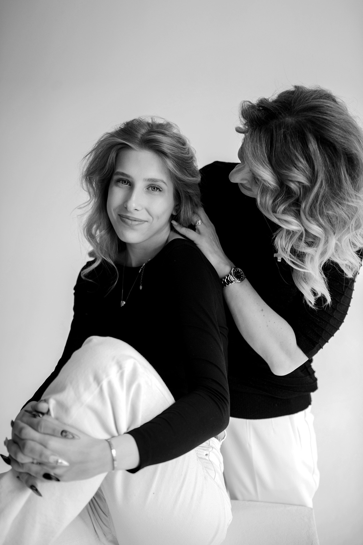 photo shoot for mom and daughter in the studio bw black and white