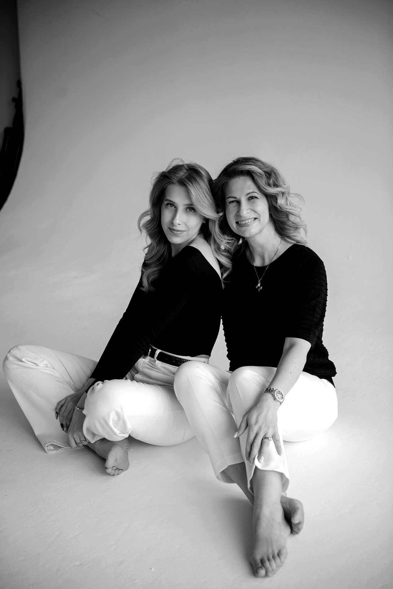 photo shoot for mom and daughter in the studio bw black and white
