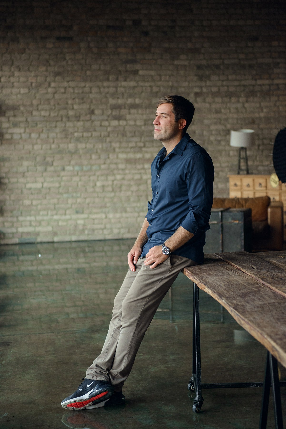 man in a dark photo studio
