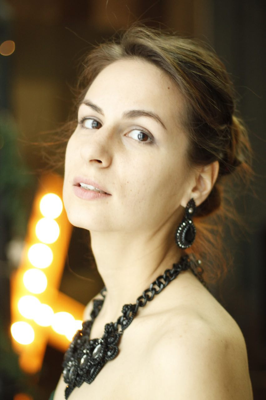 Portrait of woman with the lighters on the background by Anna Karamurzina