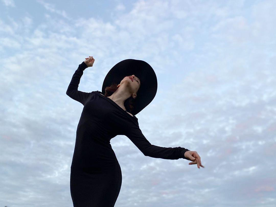 Photo of woman dancing in the sky