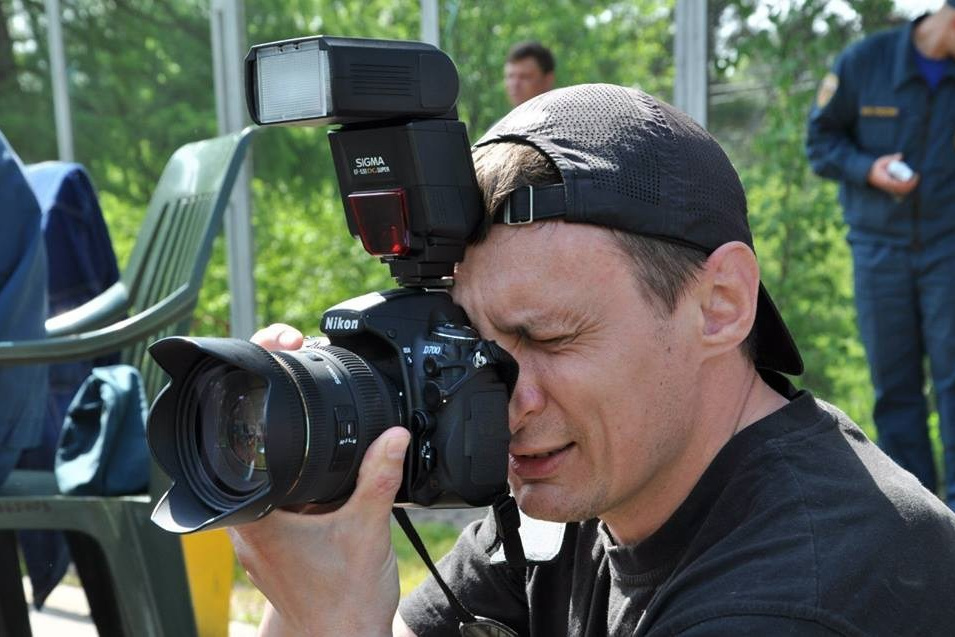 фотограф с фотоаппаратом