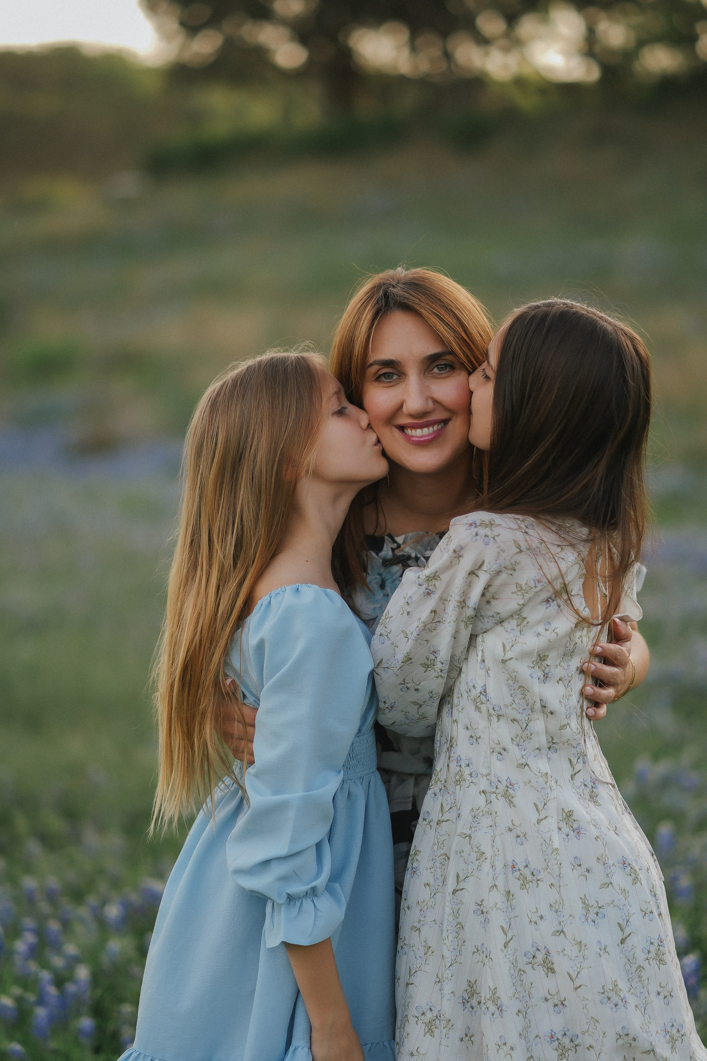 Candid family photoshoot in blooming bluebonnet field — natural light family photographer near Cedar Park and Pflugerville, by Anny Smirnova