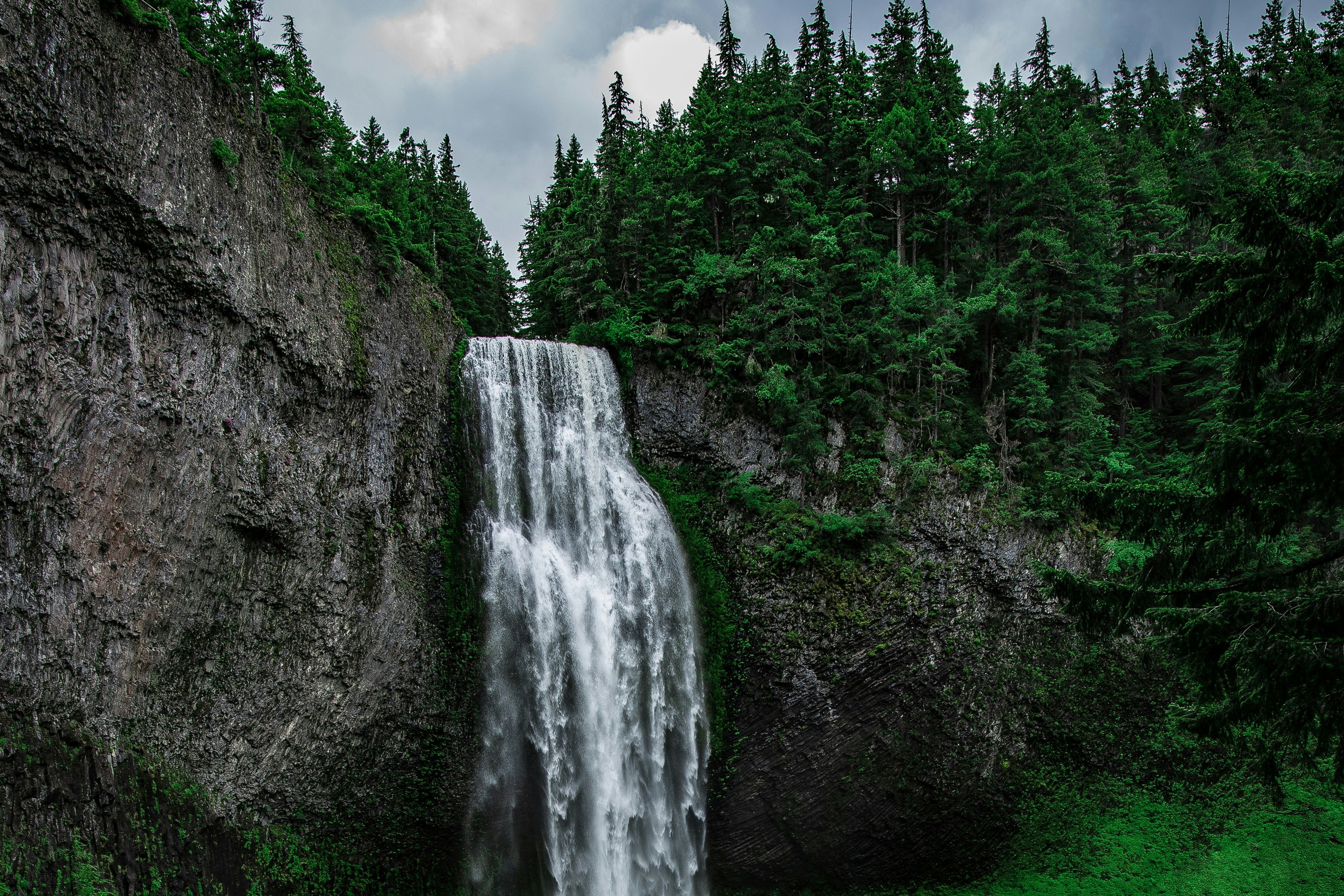 Agura waterfalls surrounded by forest trails near Sochi
