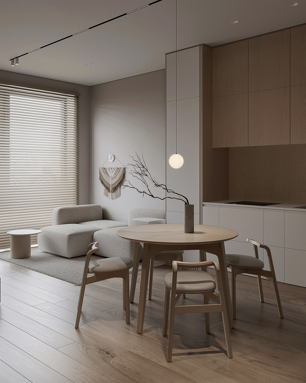 Современный интерьер кухни с круглым обеденным столом в теплых тонах.