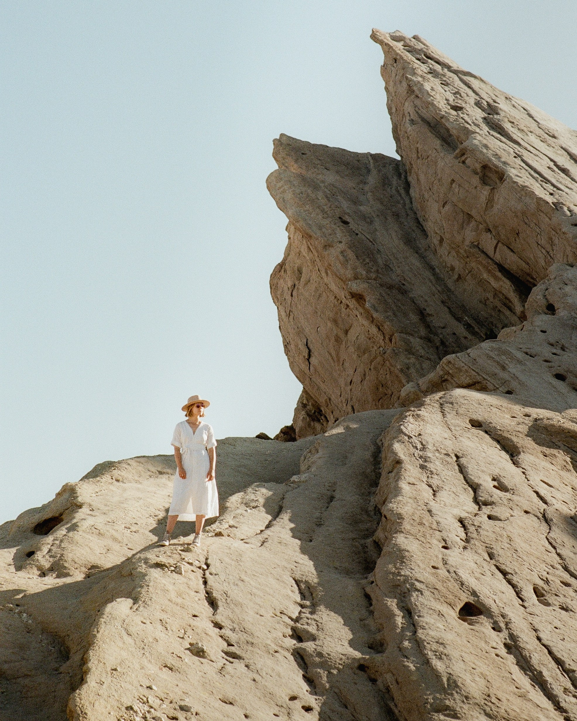 A portrait on film of a photographer surrounded by rock formations in Vasquez Rocks 