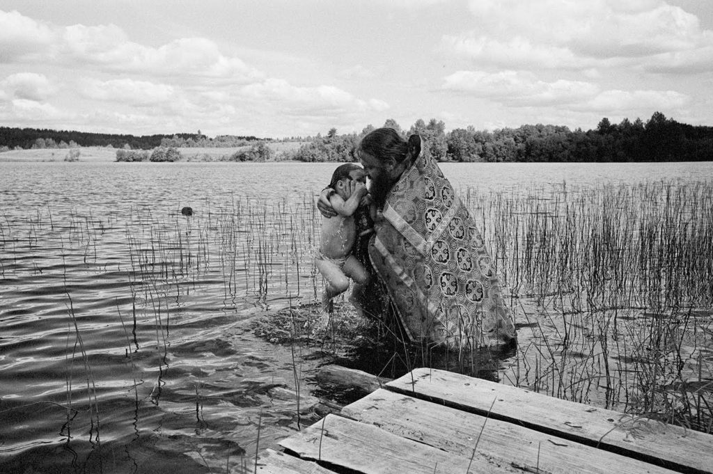 Father Arkady baptizing a child. Summer 2014.
