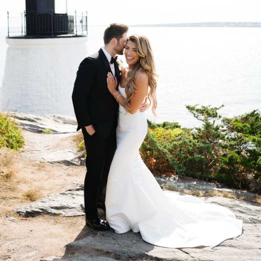 A beautiful wedding couple standing on the beach