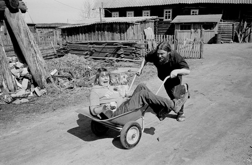 Priest Arkadiy is pushing his guest, Vera, in the courtyard. Spring 2013.
