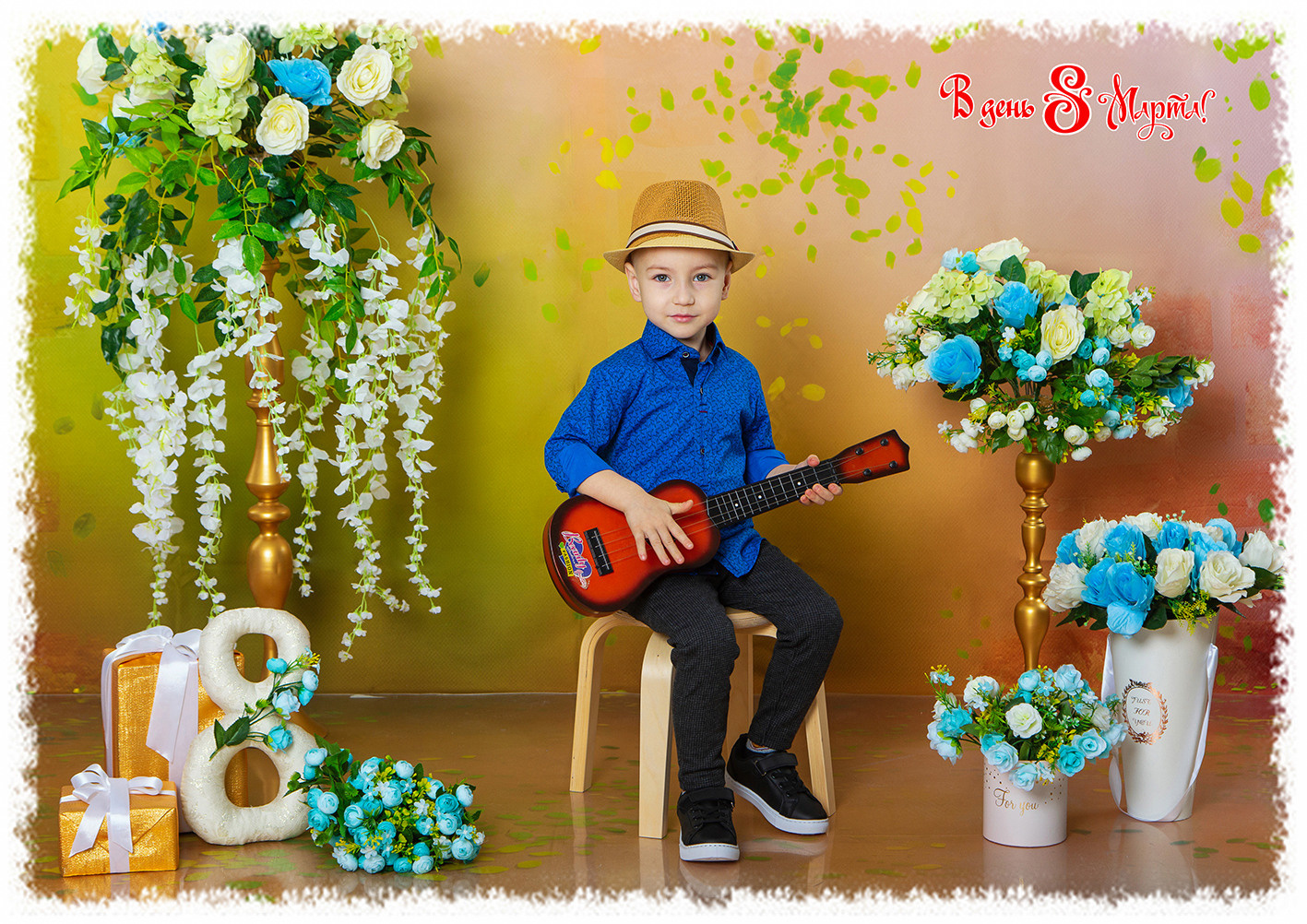 Костюмированная выездная фотосессия для детского сада к 8 марта. Мальчик с гитарой в цветах.